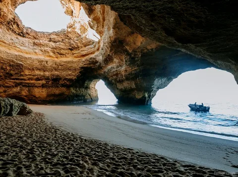 Boat departing Armacao de Pera on the Benagil Caves hidden beaches tour