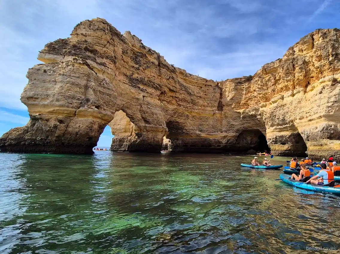 Kayaks resting on the sand inside the Benagil Caves during the kayak tour